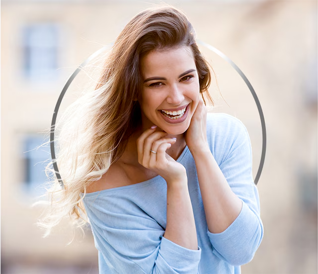 Young smiling woman taking a shower