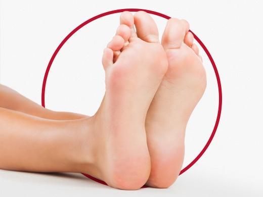 Closeup view of woman foot with beautiful and healthy nails after Canespro treatment